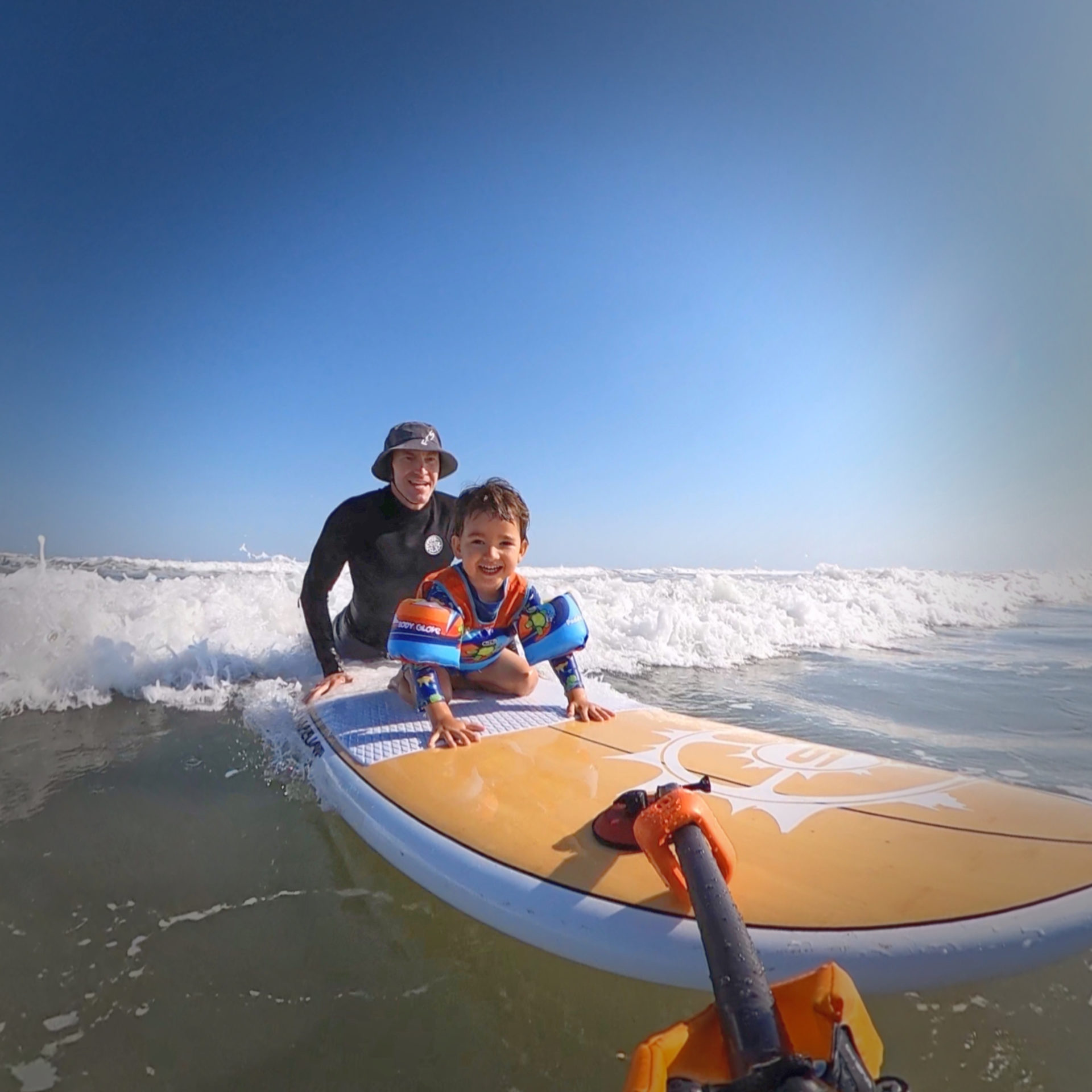 Rohan surfing with son